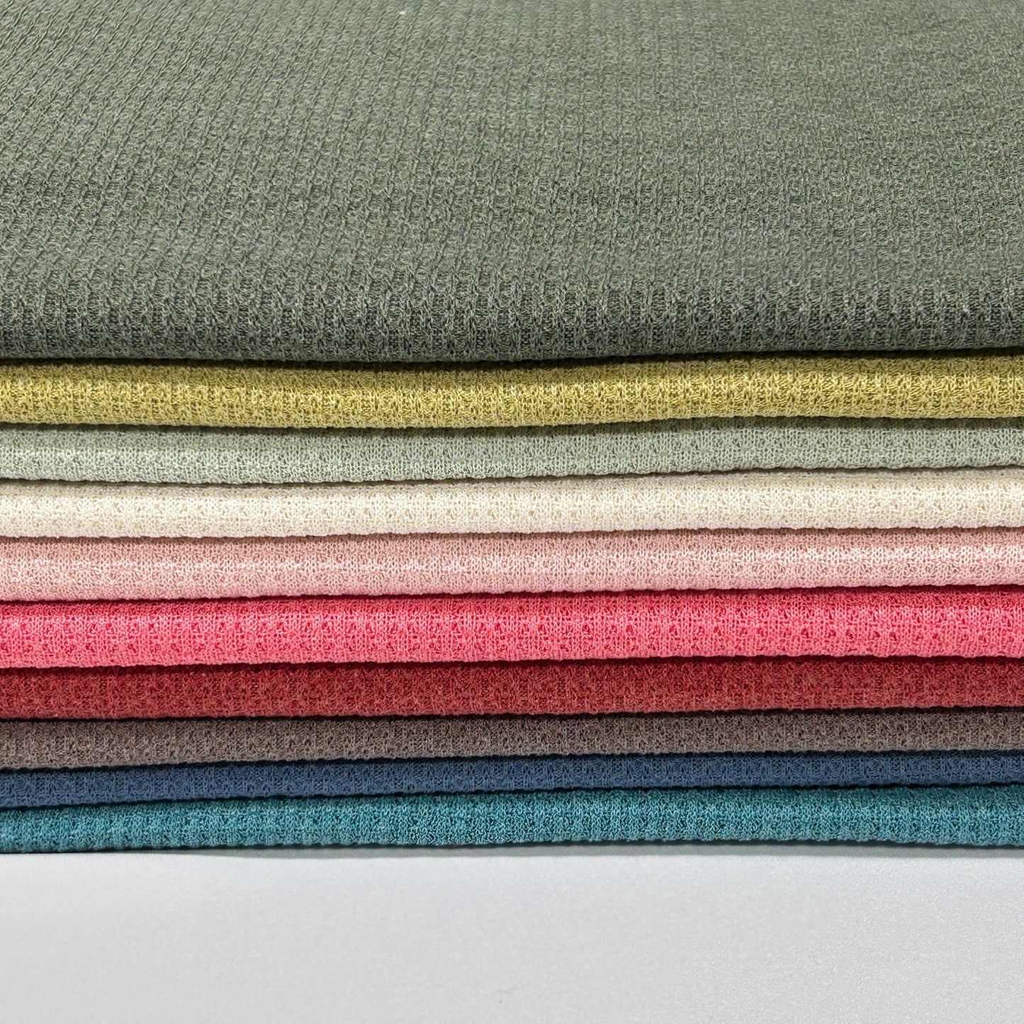 JM-Hacci Solid Color Repeated Pattern Poly Fabric.fall fabric weater, cardigan fabric. pink fabric.