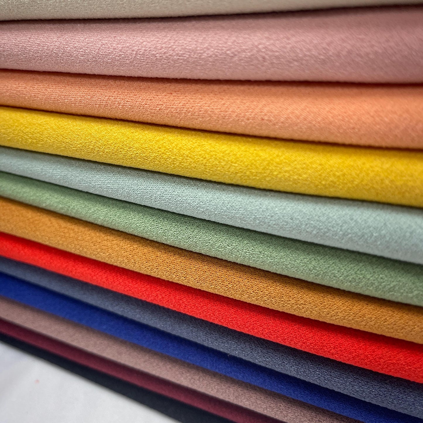 K-crepe/Knit Solid Color Textured Poly. 60" width. Fabric By The Yard.